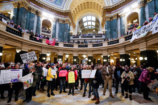 FILE - Protesters stand in the Wisconsin Capitol Rotunda during a march supporting overturning Wisconsin's near total ban on abortion, Jan. 22, 2023, in Madison, Wis. (AP Photo/Morry Gash, file) FILE - Protesters stand in the Wisconsin Capitol Rotunda during a march supporting overturning Wisconsin's near total ban on abortion, Jan. 22, 2023, in Madison, Wis. (AP Photo/Morry Gash, file)