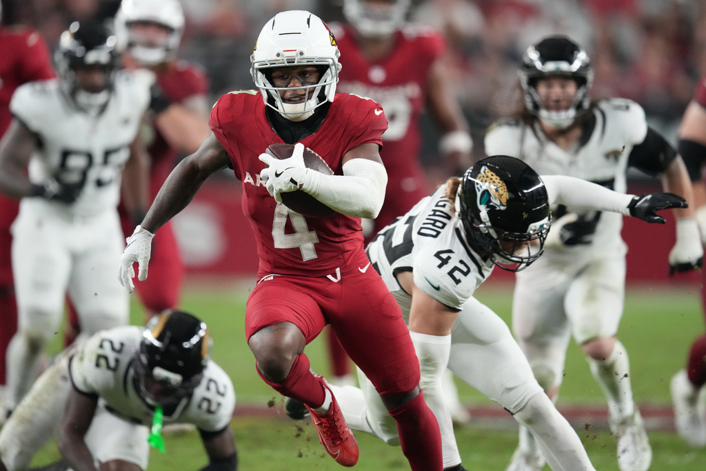 Arizona Cardinals wide receiver Greg Dortch (4) runs the ball during the second half of an NFL football game against the Jacksonville Jaguars Sunday, Nov. 23, 2025, in Glendale, Ariz. (AP Photo/Ross D. Franklin)