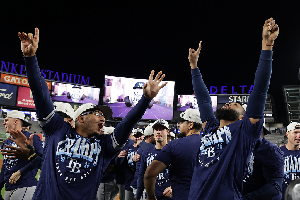 Tampa Bay Rays third baseman Junior Caminero, right, celebrates after the Rays defeated the New York Yankees in the second baseball game of a doubleheader Tuesday, Sept. 22, 2026, in New York. (AP Photo/Adam Hunger)