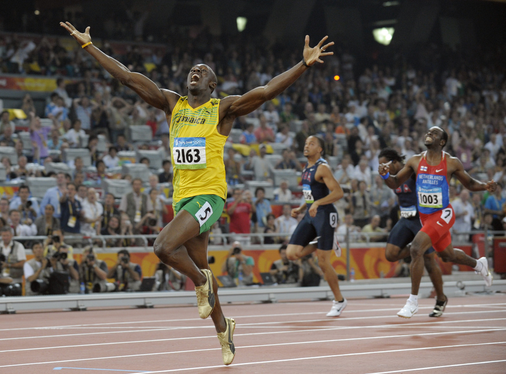 FILE - Jamaica's Usain Bolt celebrates as he wins the men's 200-meter final with a world record during the athletics competitions in the National Stadium at the Beijing 2008 Olympics in Beijing, Wednesday, Aug. 20, 2008. (AP Photo/Thomas Kienzle, File)