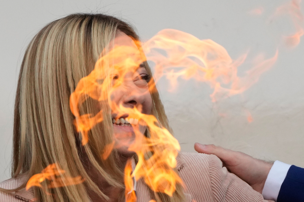 Italy's Prime Minister Giorgia Meloni laughs during the Milan Cortina 2026 Winter Olympics cauldron lighting, in front of the Quirinale Presidential Palace, in Rome, Friday Dec. 5, 2025. (AP Photo/Gregorio Borgia)
