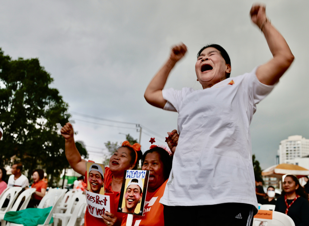 Supporters of the People's Party gesture as they gather at party headquarter for the result of the general election in Bangkok, Sunday, Feb. 8, 2026. (AP Photo/Wason Wanichakorn)