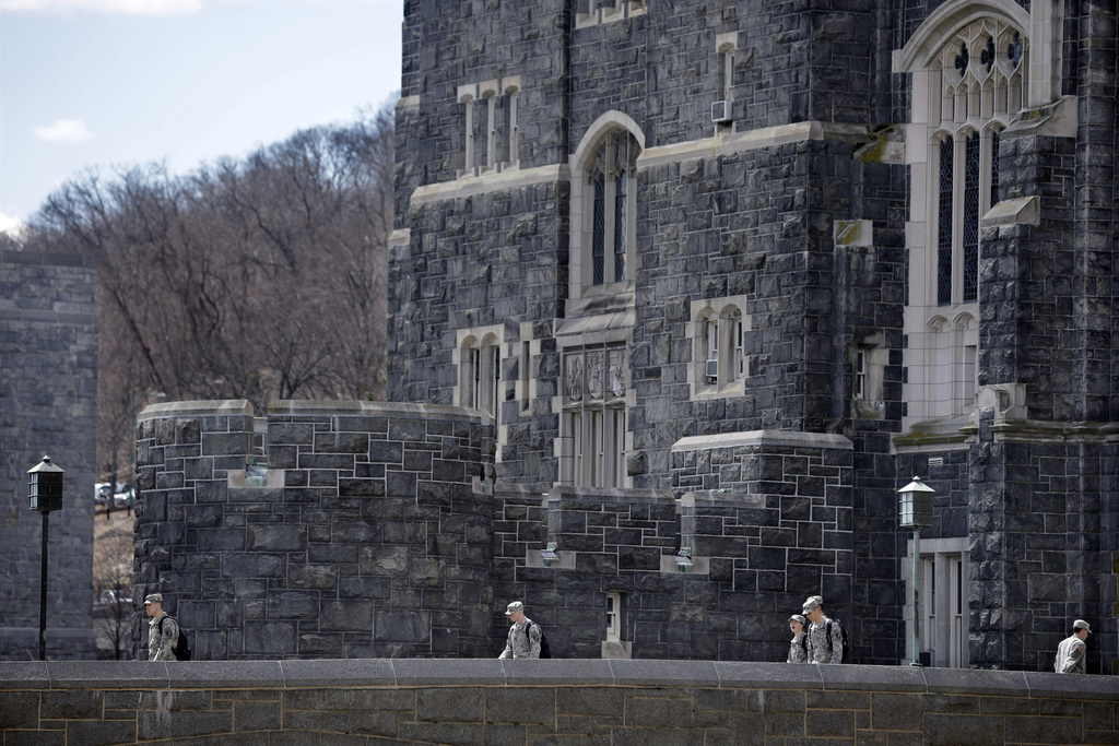 FILE - West Point cadets walk on campus during lunchtime break at the United States Military Academy in West Point, N.Y., April 9, 2014. (AP Photo/Mel Evans, File)