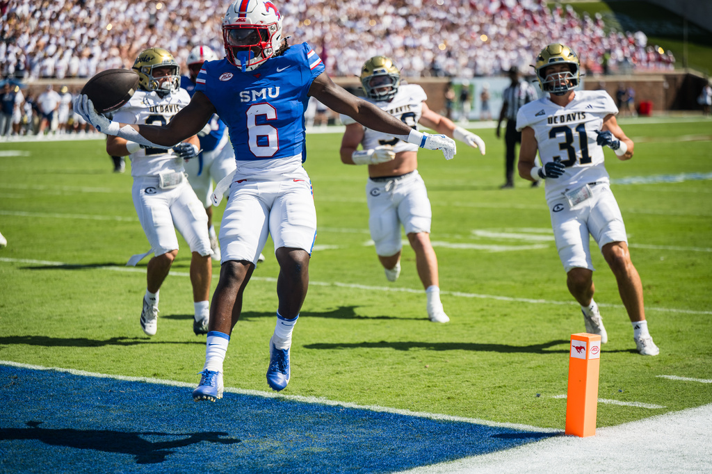 SMU's running back Kendrick Raphael (6) scores a touchdown during a football game against UC Davis in Dallas, Saturday, Sept. 12, 2026. (AP Photo/Jessica Tobias)