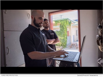 IMAGE CAPTION: Showcases our technicians setting up an alarm monitoring system (Kord Fire Protection). | Kord Fire Protection is highlighting the role of alarm monitoring in commercial buildings and offering three months of fire alarm monitoring at no charge to eligible new commercial customers under a qualifying agreement.