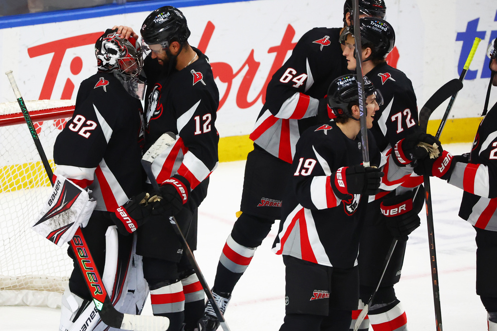 Buffalo Sabres players celebrate after a victory over the Columbus Blue Jackets in an NHL hockey game Thursday, April 9, 2026, in Buffalo, N.Y. (AP Photo/Jeffrey T. Barnes)