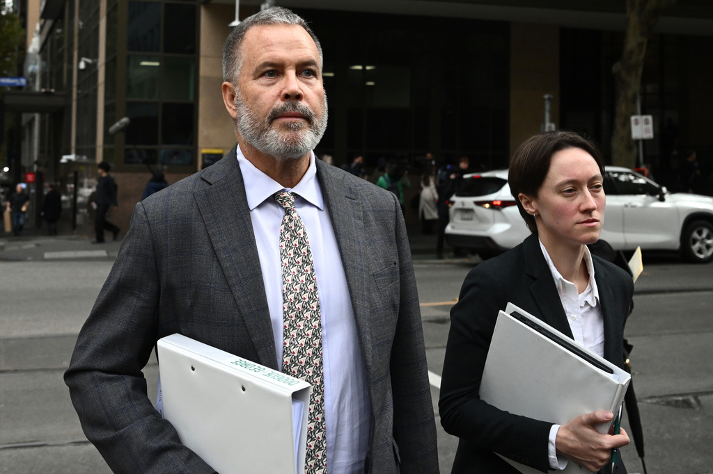 Lawyers Bill Doogue, left, representing Kawsar Abbas, and Maya George, representing Zeinab Ahmed, leave the Melbourne Magistrates' Court in Melbourne, Australia Friday, May 8, 2026, after Abbas and Ahmed were charged with slavery and terrorism offenses after they arrived home from Syria. (Joel Carrett/AAP Image via AP)