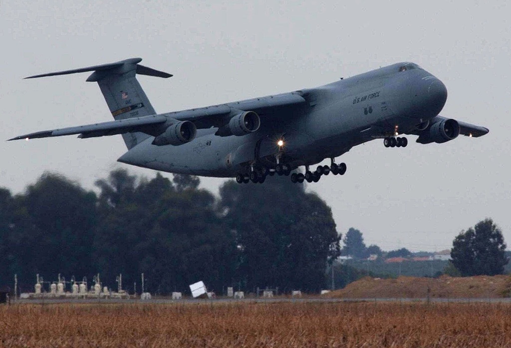 FILE -A U.S. Air Force C-5 Galaxy takes off from the joint-use Spanish and U.S. air base in Moron, southern Spain, Friday, Sept. 28, 2001. (AP Photo/Cristina Quicler, File)