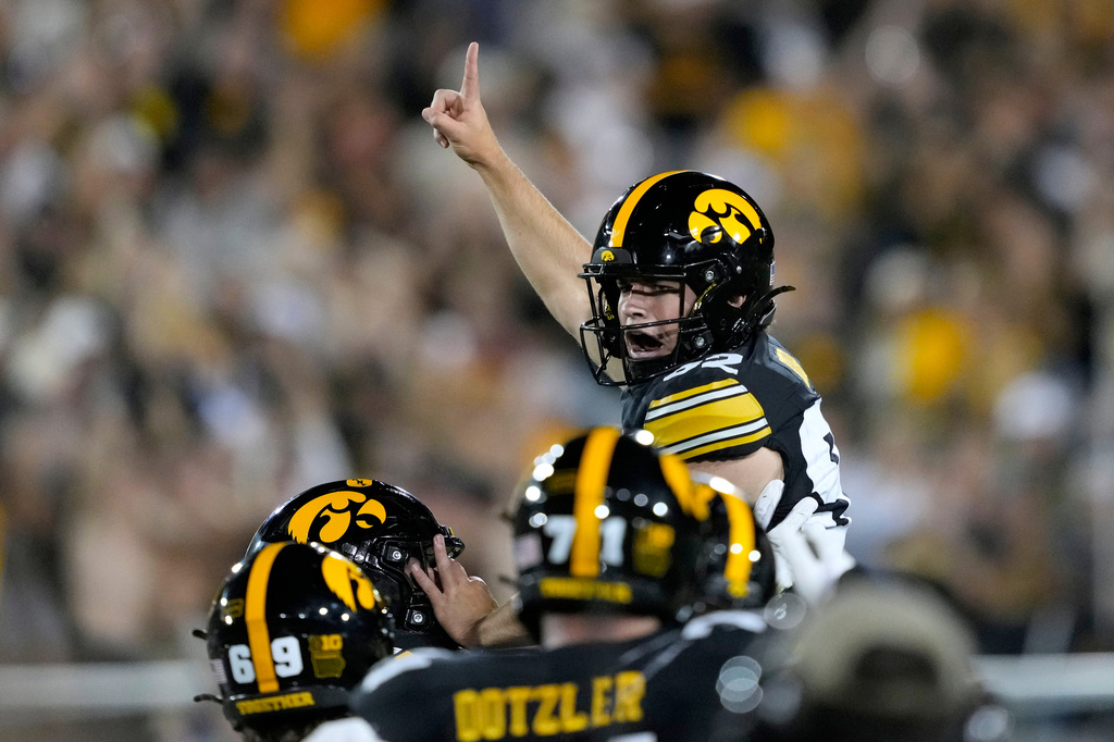 Iowa place kicker Caden Buhr celebrates with teammates after kicking a field goal during the second half of an NCAA college football game against Iowa State, Saturday, Sept. 12, 2026, in Iowa City, Iowa. (AP Photo/Charlie Neibergall)