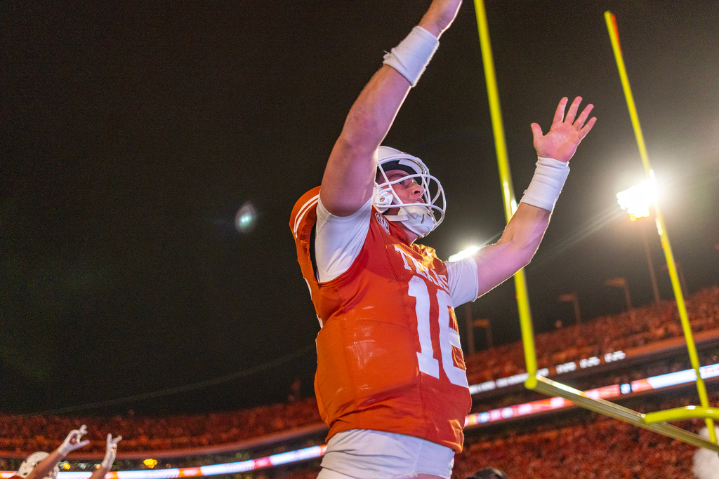 Texas quarterback Arch Manning (16) celebrated a touchdown against Texas A&M during the second half of an NCAA college football game Friday, Nov. 28, 2025, in Austin, Texas. (AP Photo/Stephen Spillman)