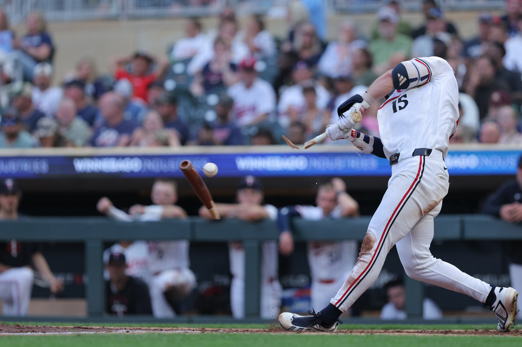 Minnesota Twins' Luke Keaschall breaks his bat resulting in a single during the sixth inning of a baseball game against the Cleveland Guardians, Tuesday, July 7, 2026, in Minneapolis. (AP Photo/Bailey Hillesheim)