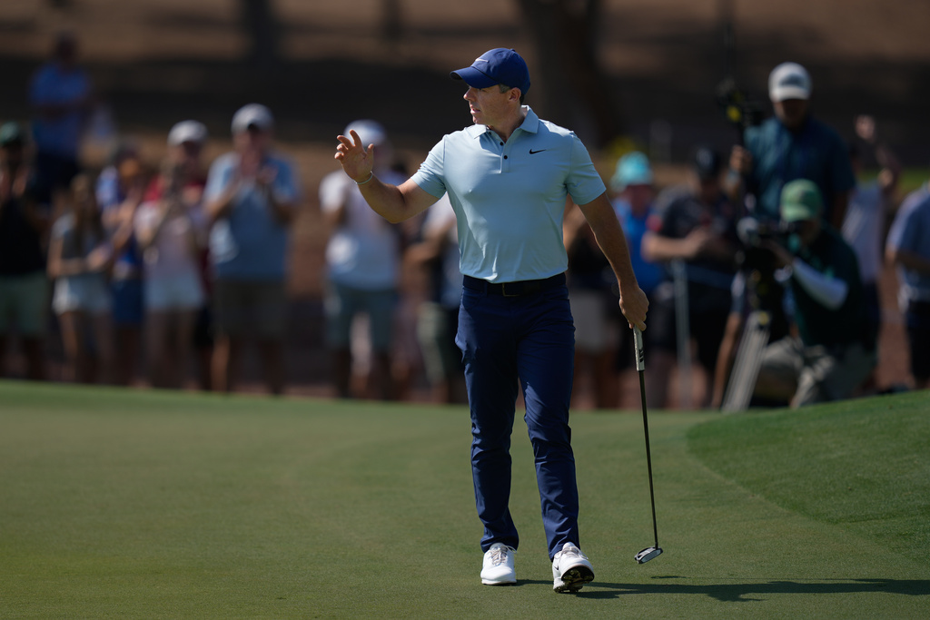 Rory McIlroy of Northern Ireland reacts after a birdie on the 1st hole during the final round of World Tour Golf Championship in Dubai, United Arab Emirates, Sunday, Nov. 16, 2025. (AP Photo/Altaf Qadri)