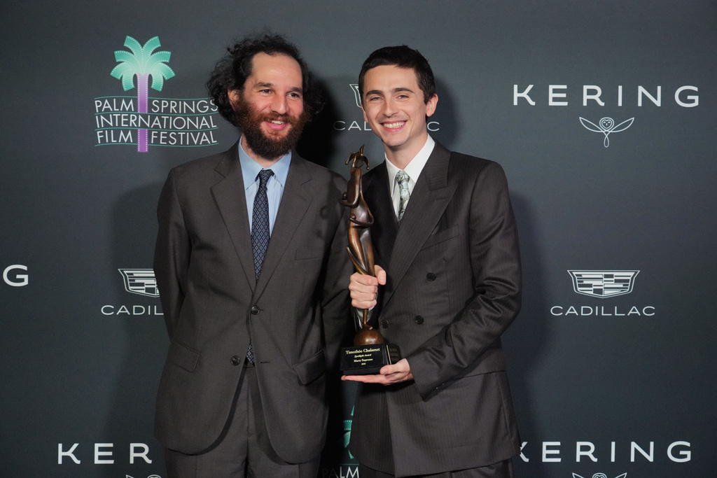 Josh Safdie, left, and Timothee Chalamet, with the spotlight actor of the year award for "Marty Supreme," pose in the press room during the 37th Palm Springs International Film Festival Film Awards on Saturday, Jan. 3, 2026 at Palm Springs Convention Center in Palm Springs, Calif. (Photo by Jordan Strauss/Invision/AP)