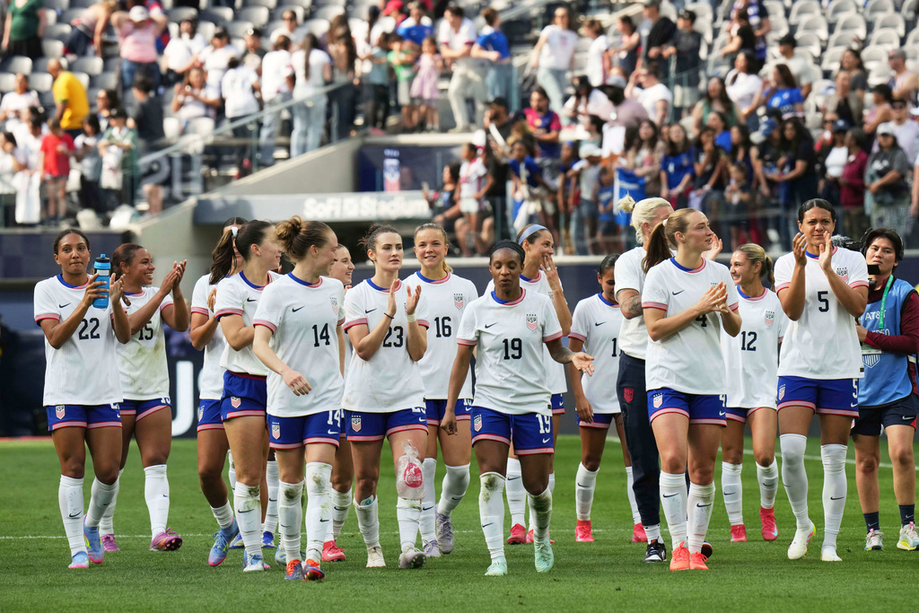 FILE - United States players acknowledge fans as they celebrate the team's win against Brazil in a women's international friendly soccer match in Inglewood, Calif., April 5, 2025. (AP Photo/Jae C. Hong, File)