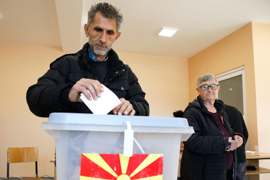 A man casts his ballot in the runoff local elections, at a polling station in Skopje, North Macedonia, on Sunday, Nov. 2, 2025. (AP Photo/Boris Grdanoski)