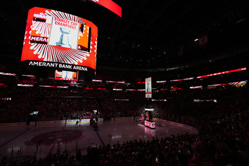 The 2025 Stanley Cup banner is raised over the arena ahead of the Florida Panthers' home opener NHL hockey game against the Chicago Blackhawks, Tuesday, Oct. 7, 2025, in Sunrise, Fla. (AP Photo/Rebecca Blackwell)