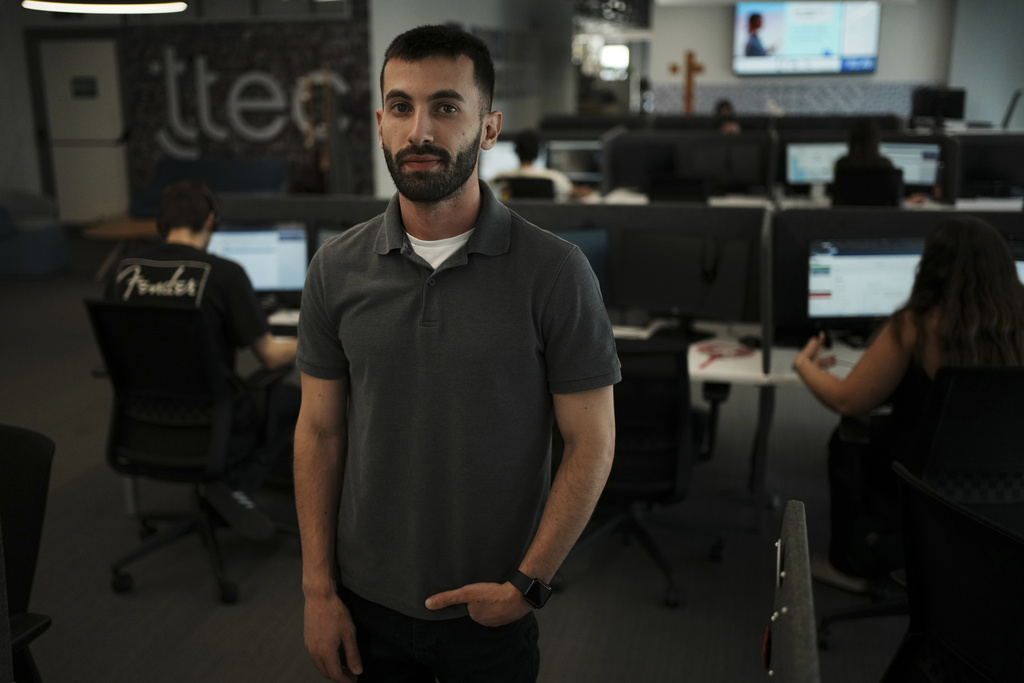 Armen Kirakosian, Global Senior Manager, Learning & Development TTEC poses in Athens, Greece, Thursday, Aug. 21, 2025. (AP Photo/Thanassis Stavrakis)