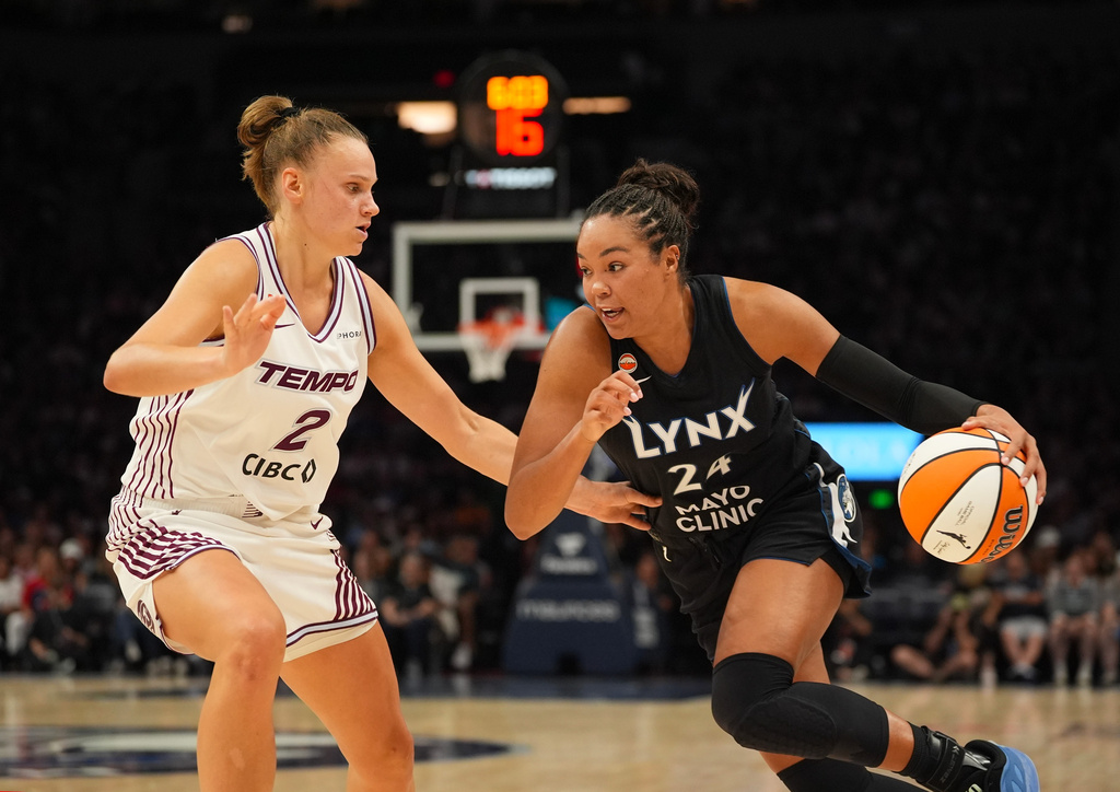 Minnesota Lynx forward Napheesa Collier (24) drives around Toronto Tempo forward Laura Juskaite (2) in the second quarter of a WNBA basketball game Tuesday, July 28, 2026, in Minneapolis. (Jeff Wheeler/Minnesota Star Tribune via AP)