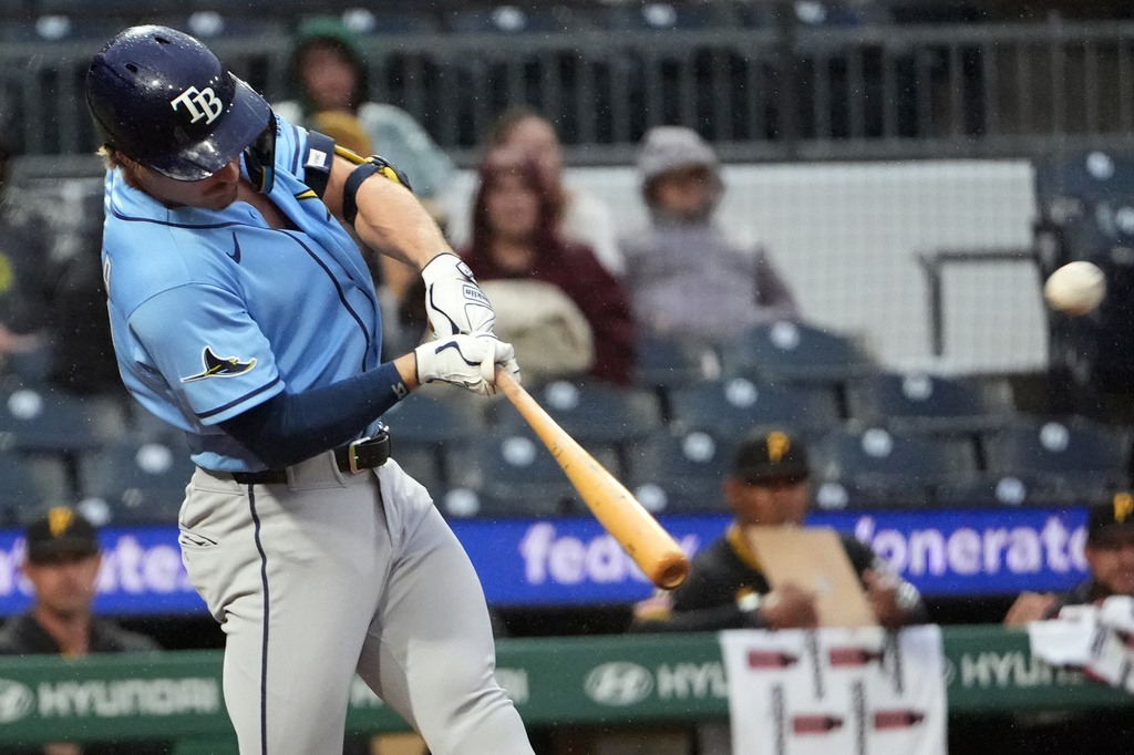 Tampa Bay Rays' Jonny DeLuca connects with a pitch from Pittsburgh Pirates' Evan Sisk for an RBI double in the fifth inning of a baseball game in Pittsburgh, Saturday, April 18, 2026. (AP Photo/Tom E. Puskar)