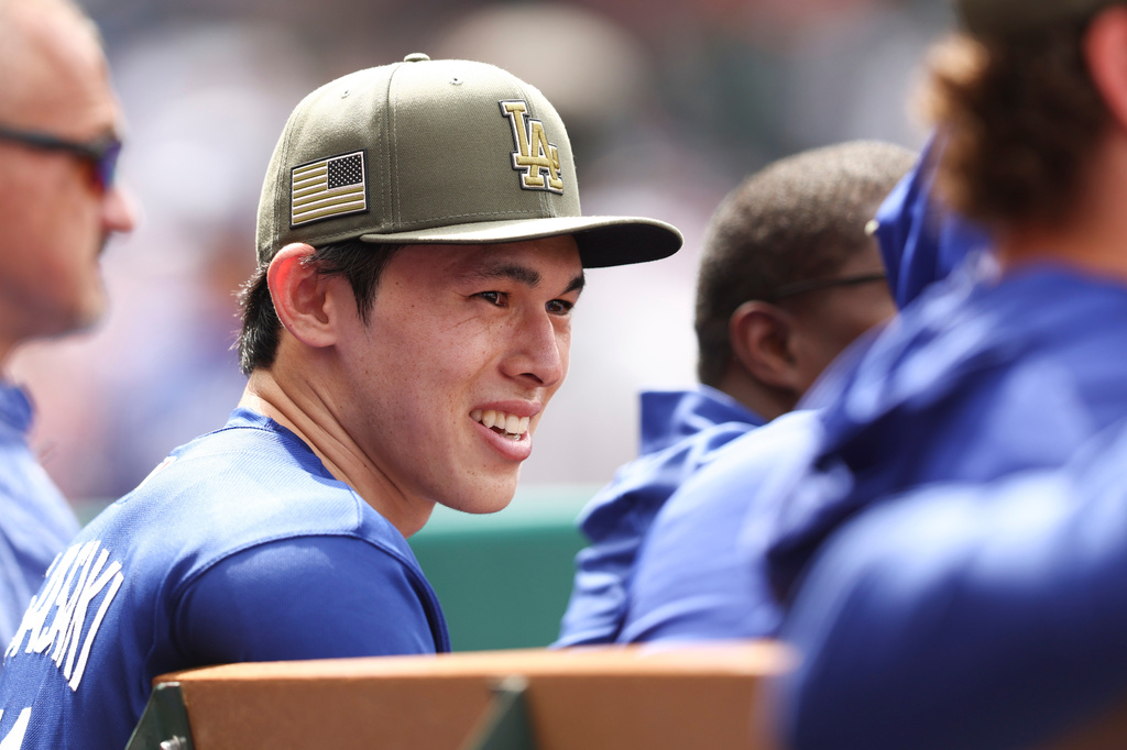 Los Angeles Dodgers pitcher Roki Sasaki reacts in the dugout during the eighth inning of a baseball game against the Los Angeles Angels, Sunday, May 17, 2026, in Anaheim, Calif. (AP Photo/Jessie Alcheh)