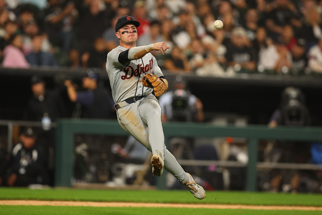 Detroit Tigers' Kevin McGonigle throws to first late as Chicago White Sox's Brenton Doyle bunt single during the sixth inning of a baseball game, Thursday, Sept. 17, 2026, in Chicago. (AP Photo/Melissa Tamez)