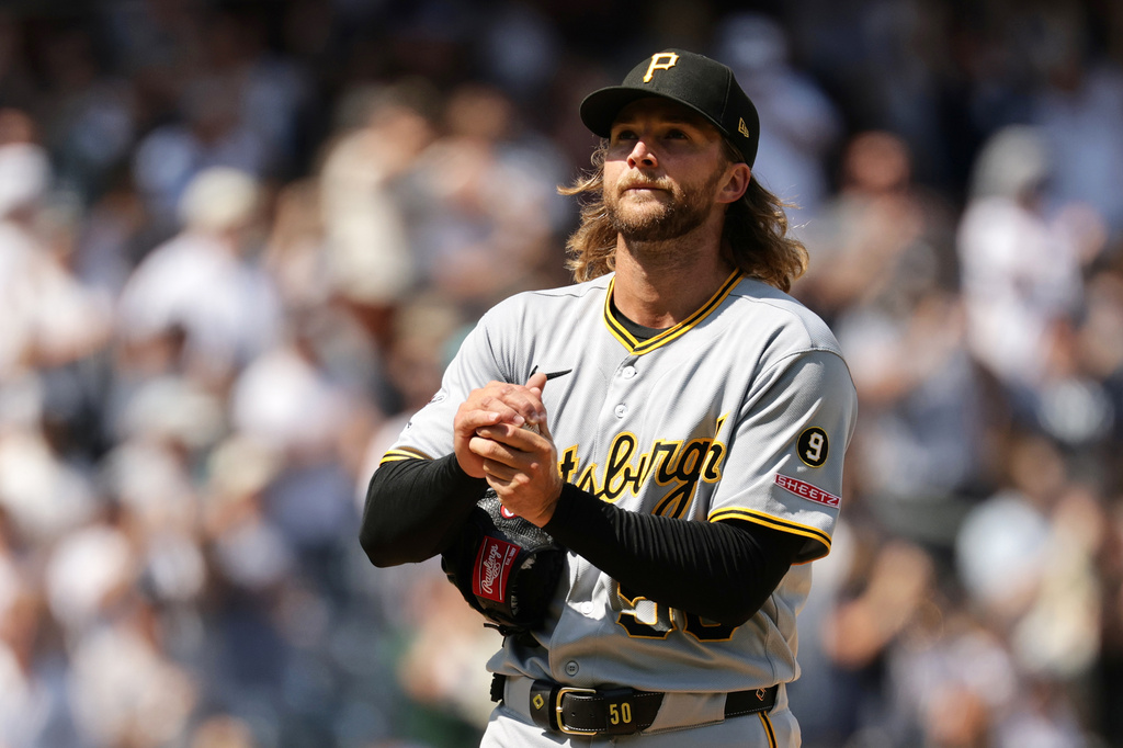 Pittsburgh Pirates pitcher Carmen Mlodzinski reacts after giving up a three-run home run to New York Yankees' Ben Rice in the seventh inning during the first baseball game of a doubleheader, Wednesday, July 22, 2026, in New York. (AP Photo/Adam Hunger)