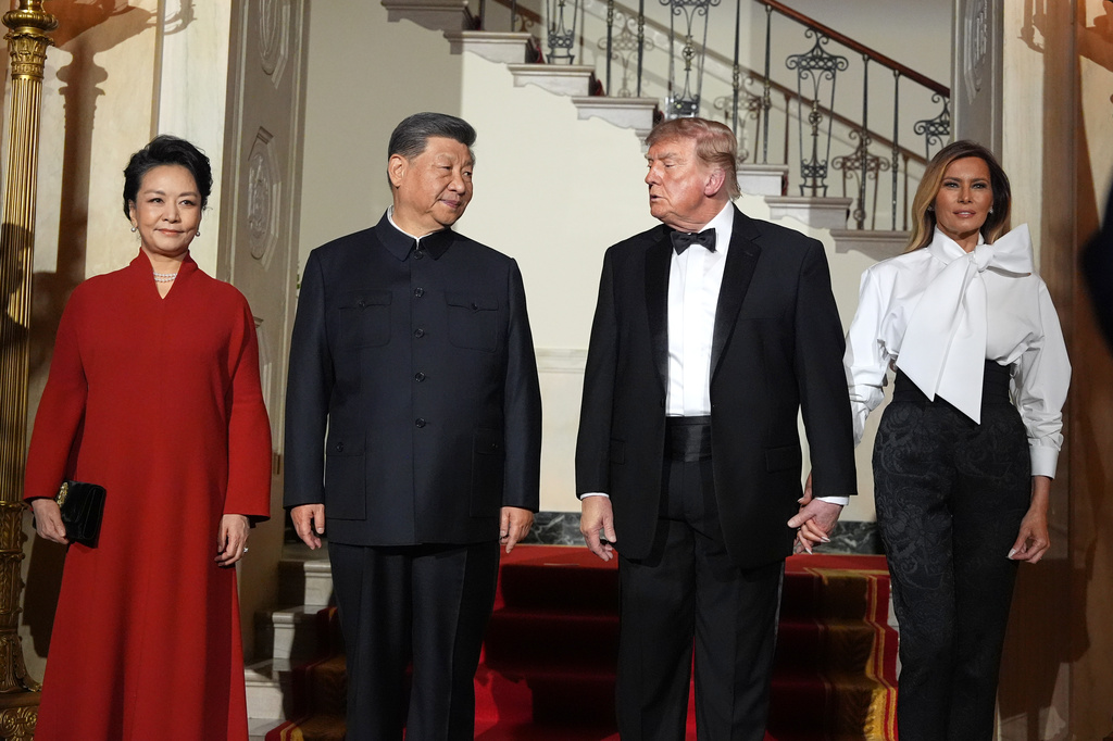 President Donald Trump and first lady Melania Trump pose for a photo with China's President Xi Jinping and his wife Peng Liyuan in the Grand Foyer of the White House during a State Dinner, Thursday, Sept. 24, 2026, in Washington. (AP Photo/Alex Brandon)