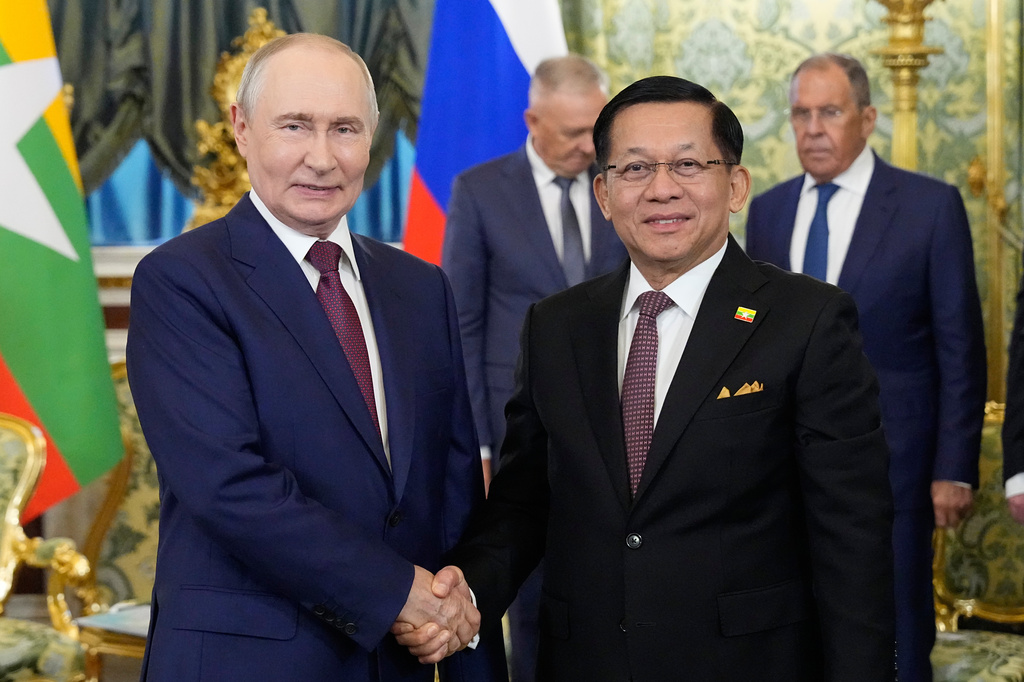 Russian President Vladimir Putin, left, and Myanmar President Min Aung Hlaing pose for photos during their meeting at the Grand Kremlin Palace, in Moscow, Tuesday, Aug. 18, 2026. (AP Photo/Alexander Zemlianichenko, Pool)