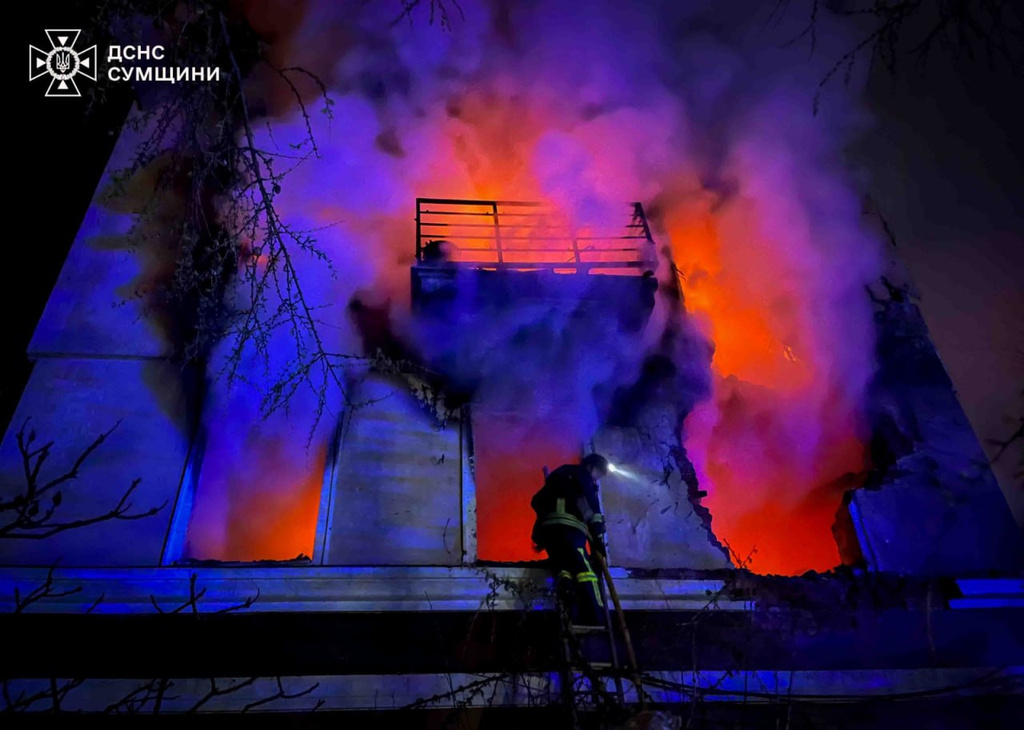 In this photo provided by the Ukrainian Emergency Services on Wednesday, April 29, 2026, a rescue worker puts out a fire of a residential building damaged by a Russian drone strike on Sumy region, Ukraine. (Ukrainian Emergency Service via AP)