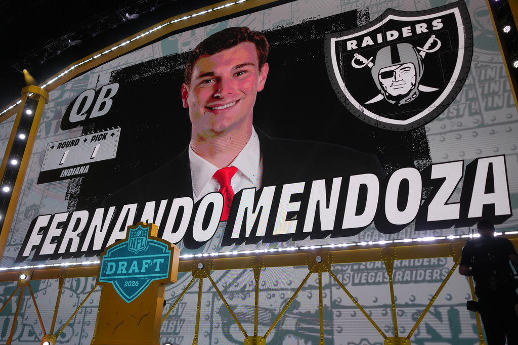 Indiana quarterback Fernando Mendoza is shown on a screen after being chosen by the Las Vegas Raiders with the first overall pick during the first round of the NFL football draft, Thursday, April 23, 2026, in Pittsburgh. (AP Photo/Gene J. Puskar)