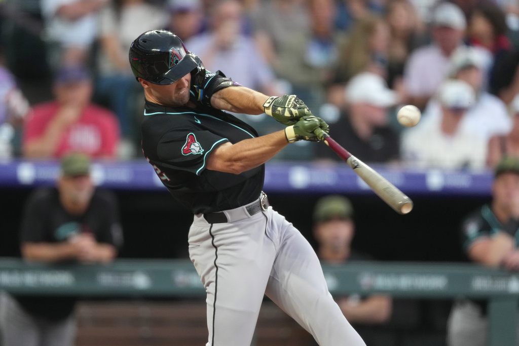 Arizona Diamondbacks' Ryan Waldschmidt connects for a single to drive in two runs off Colorado Rockies starting pitcher Kyle Freeland in the first inning of a baseball game, Friday, May 15, 2026, in Denver. (AP Photo/David Zalubowski)