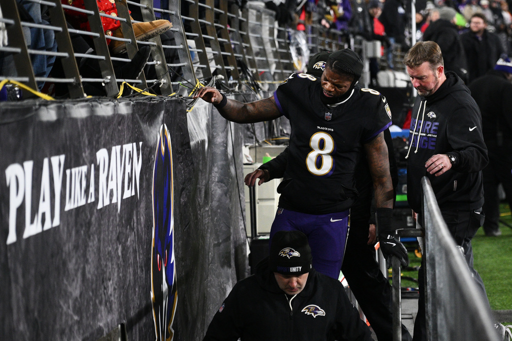 Baltimore Ravens quarterback Lamar Jackson (8) leaves the field during the first half of an NFL football game against the New England Patriots, Sunday, Dec. 21, 2025, in Baltimore. (AP Photo/Nick Wass)