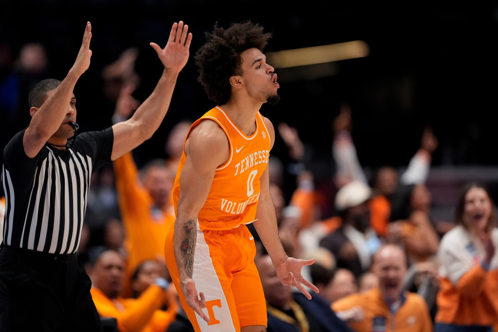 Tennessee guard Ja'kobi Gillespie (0) celebrates his three-point basket against Vanderbilt during the second half of an NCAA college basketball game in the quarterfinal round of the Southeastern Conference tournament, Friday, March 13, 2026, in Nashville, Tenn. (AP Photo/George Walker IV)