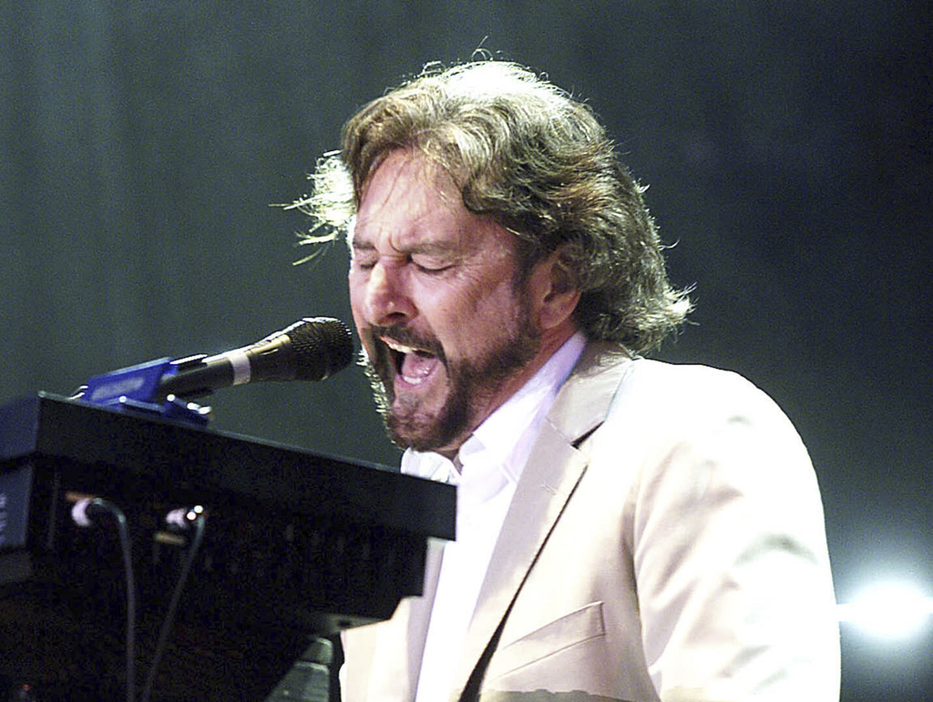 FILE - Rick Davies plays the keyboards while singing during the British band Supertramp's concert in Budapest, on Friday evening, June 28, 2002. (Noemi Bruzak/MTI via AP)/MTI via AP)