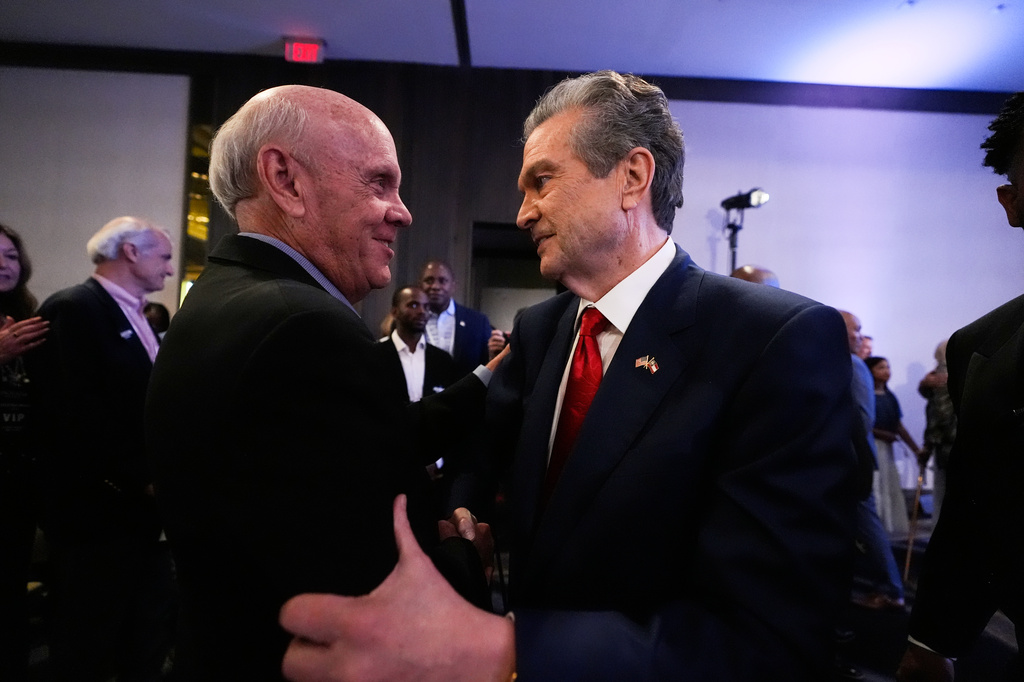 Georgia gubernatorial candidate Rick Jackson talks to a supporter after speaking during a primary election night party on Tuesday, May 19, 2026, in Atlanta. (AP Photo/Brynn Anderson)
