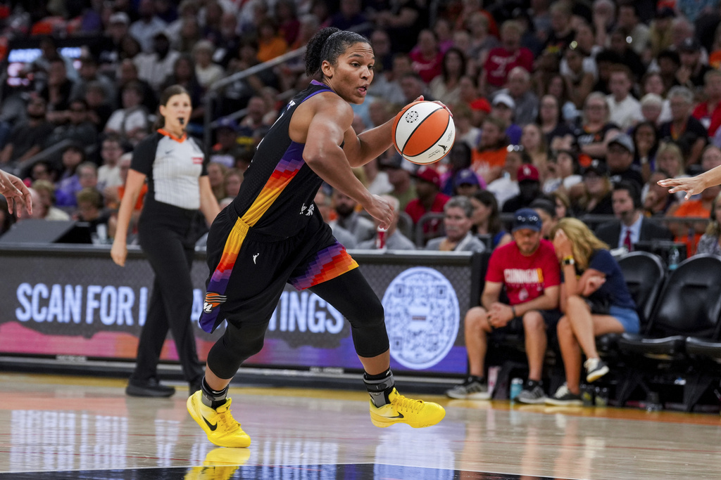 Phoenix Mercury forward Alyssa Thomas dribbles the ball during the second half of a WNBA basketball game against the Indiana Fever, Tuesday, Sept. 2, 2025, in Phoenix. (AP Photo/Samantha Chow)