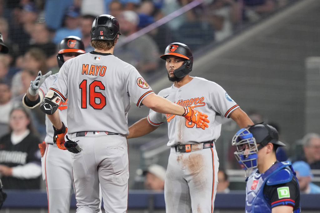 Baltimore Orioles' Coby Mayo (16) celebrates his home run with teammates against the Toronto Blue Jays during sixth inning of a baseball game in Toronto on Friday, June 5, 2026. (Nathan Denette/The Canadian Press via AP)