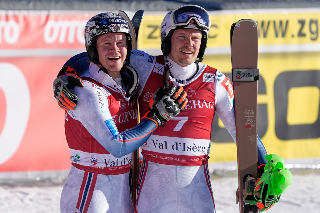 Norway's Timon Haugan, left, winner of an alpine ski, men's World Cup slalom event, celebrates with second placed fellow-countryman Henrik Kristoffersen, in Val d'Isere, France, Sunday Dec. 14, 2025. (AP Photo/Giovanni Auletta)