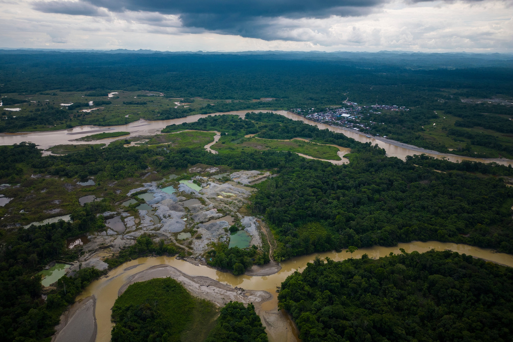 FILE - Visible deforestation from illegal mining is visible along rivers near Paimado, Colombia, Sept. 24, 2024. (AP Photo/Ivan Valencia, File)