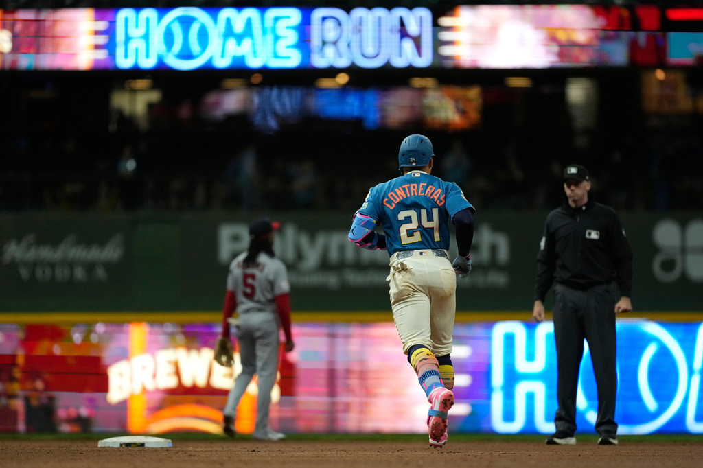 Milwaukee Brewers' William Contreras rounds the bases after hitting a solo home run during the ninth inning of a baseball game against the Washington Nationals, Saturday, April 11, 2026, in Milwaukee. (AP Photo/Aaron Gash)
