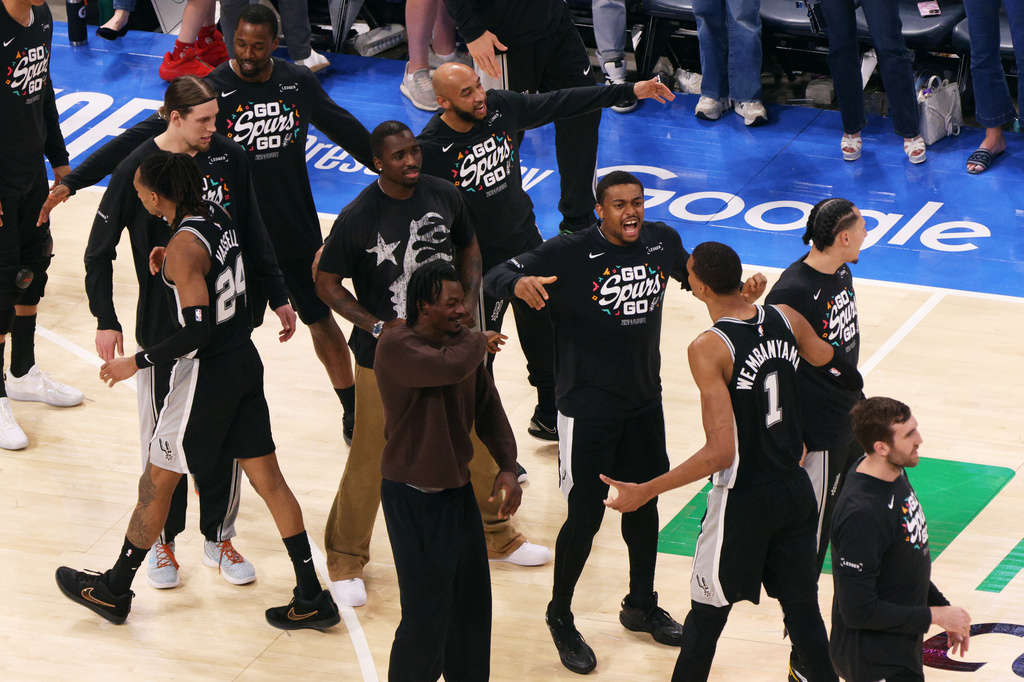 San Antonio Spurs forward Victor Wembanyama (1) celebrates with teammates during the second overtime of Game 1 in a third-round NBA basketball playoffs series against the Oklahoma City Thunder Monday, May 18, 2026, in Oklahoma City. (AP Photo/Nate Billings)
