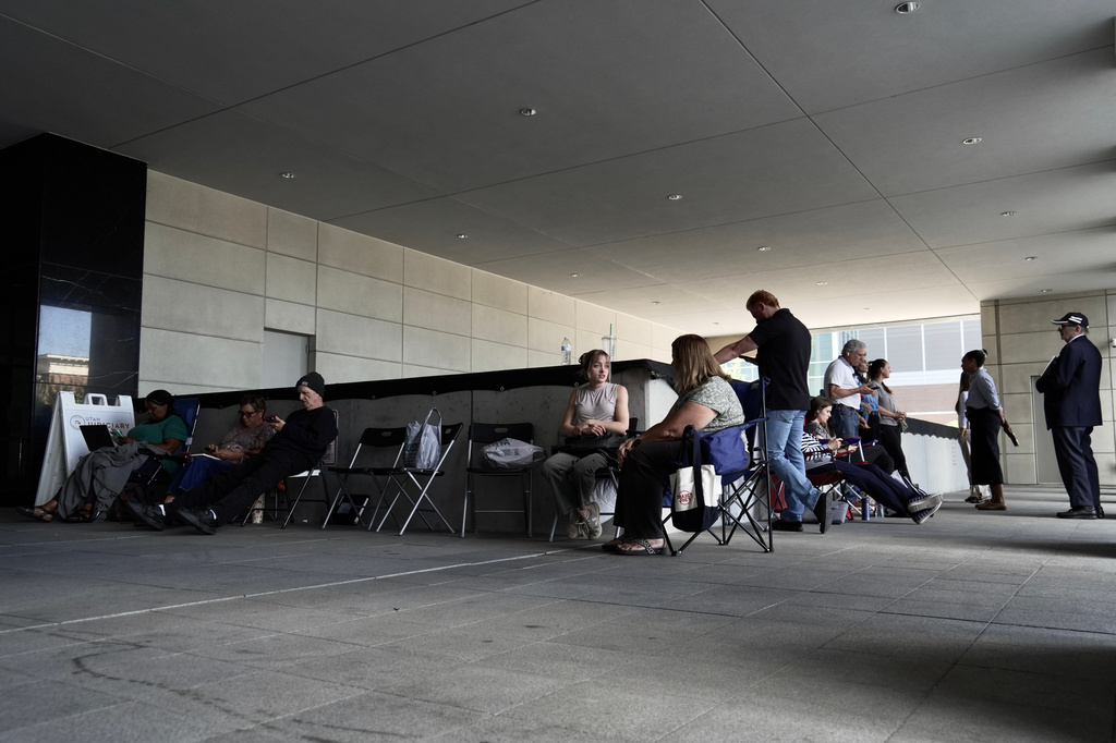 A line forms for people looking to access limited public seating available at a preliminary hearing for Tyler Robinson, the Utah man accused of fatally shooting Charlie Kirk, in Provo, Utah, Wednesday, July 8, 2026. (AP Photo/Ty ONeil)