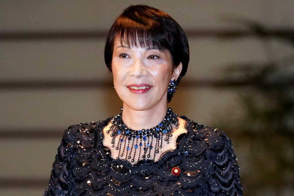 FILE - Sanae Takaichi, newly appointed Internal Affairs and Communications minister, enters the prime minister's official residence in Tokyo Wednesday, Sept. 11, 2019. (AP Photo/Eugene Hoshiko, File)