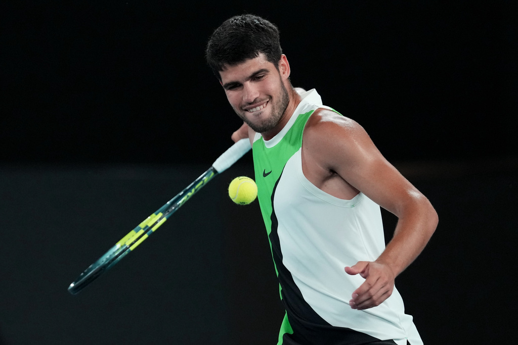 Carlos Alcaraz of Spain celebrates after defeating Alex de Minaur of Australia in their quarterfinal match at the Australian Open tennis championship in Melbourne, Australia, Tuesday, Jan. 27, 2026. (AP Photo/Dita Alangkara)