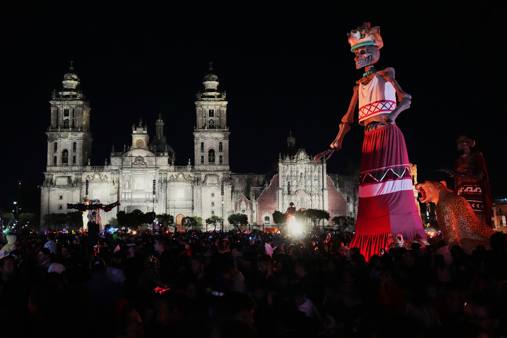 A skeleton sculpture stands on an altar at the Zocalo, Mexico City's main square, ahead of the Day of the Dead, Friday, Oct. 31, 2025. (AP Photo/Claudia Rosel)