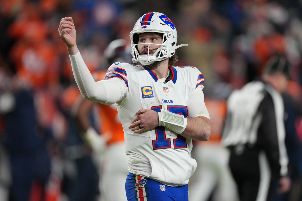 Buffalo Bills quarterback Josh Allen reacts after throwing an interception during overtime of an NFL divisional round playoff football game against the Denver Broncos, Wednesday, Jan. 17, 2024, in Denver. (AP Photo/David Zalubowski)