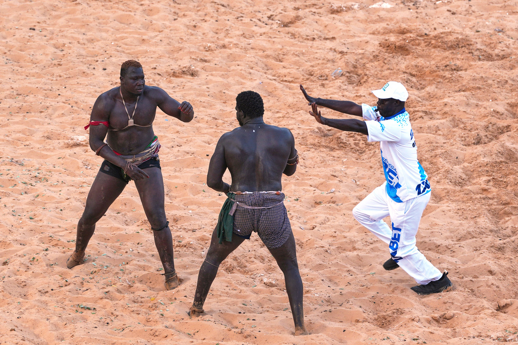 Wrestlers compete at the national wrestling arena in Dakar, Senegal, Sunday, April 5, 2026. (AP Photo/Misper Apawu)