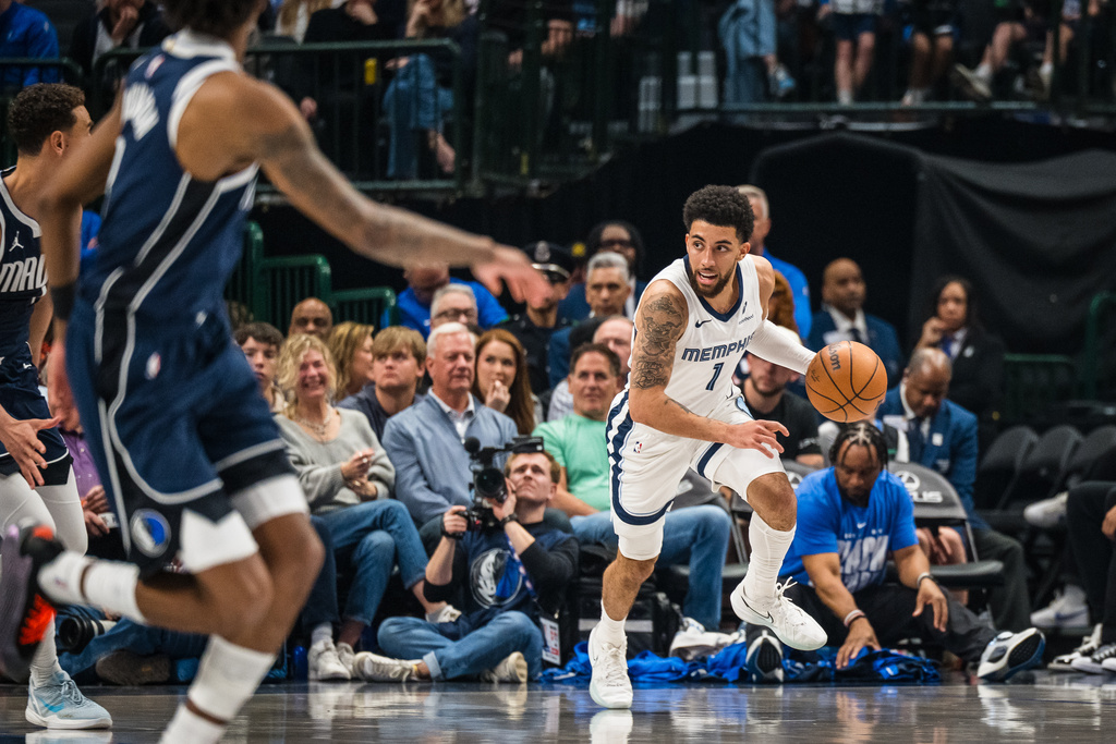 Memphis Grizzlies guard Scotty Pippen Jr. (1) drives the ball during an NBA basketball game against the Dallas Mavericks, Friday, Feb. 27, 2026, in Dallas. (AP Photo/Jessica Tobias)