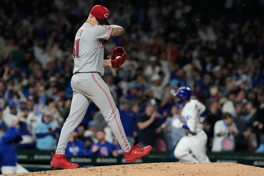 Cincinnati Reds starting pitcher C. Petty wipes his face after Chicago Cubs' Seiya Suzuki, of Japan, hit a three-run home run during the fourth inning of a baseball game in Chicago, Monday, May 4, 2026. (AP Photo/Nam Y. Huh)