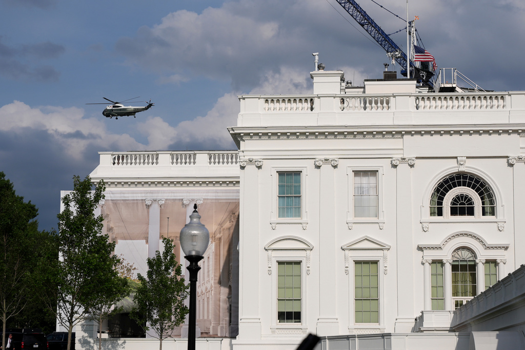 A helicopter from Marine Helicopter Squadron One, or HMX-1, flies past the White House after President Donald Trump arrived at the Ellipse near the White House, Friday, Aug. 28, 2026, in Washington, on return from Houston. (AP Photo/Jacquelyn Martin)